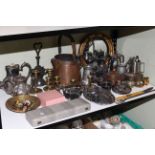 Shelf collection including large copper jug, silver plated teapots, cased cutlery, candlesticks,