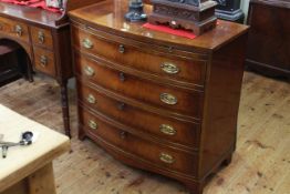 Mahogany and ebony line inlaid bow front chest having brush slide above four long drawers,