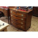 Mahogany and ebony line inlaid bow front chest having brush slide above four long drawers,