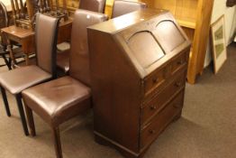 Oak three drawer bureau and four faux leather dining chairs (3x1).