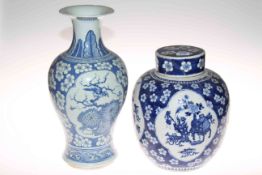 Chinese black lacquer storage table 47cm x 36cm diameter and two blue and white Chinese vases.