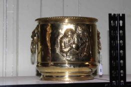 Brass embossed two handled jardiniere, 26cm.