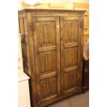 Oak linen fold panel double door fitted wardrobe 180cm x 120cm.