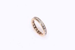 9 carat gold and white sapphire eternity ring, size H.
