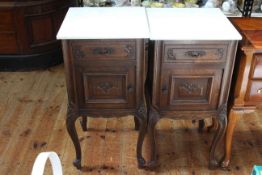 Pair Continental carved oak marble topped bedside pedestals, 81cm by 40cm.