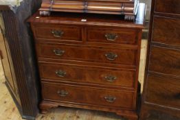 Burr and chequer inlaid chest of two short above three long drawers on ogee bracket feet,