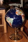 Brass and semi-precious stone terrestial globe on stand.