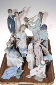 Collection of seven Nao and two Lladro figures.