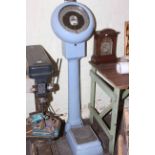 Vintage Avery coin operated personal scales.