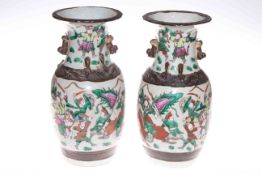 Pair of Chinese crackle glaze vases decorated with warriors on battlefield, 34cm high.