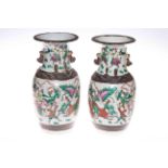 Pair of Chinese crackle glaze vases decorated with warriors on battlefield, 34cm high.