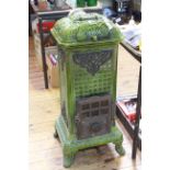 A. Martin Art Nouveau cast iron wood burning stove in emerald green, 99cm by 42cm.