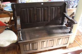 Oak linen fold panelled monks bench, 77cm by 122cm (closed).