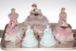 Two Coalport figures and five crinoline ladies.