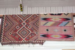 Two Turkish rugs with a geometric design, 3.00 by 1.52 and 2.10 by 1.15.