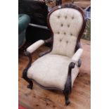 Victorian mahogany open armchair in light buttoned fabric.