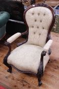 Victorian mahogany open armchair in light buttoned fabric.