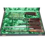 German stainless steel carver and poultry serving set, boxed.