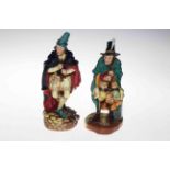 Two Royal Doulton figures, The Mask Sellar and The Pied Piper.