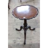 Circular dished top occasional table on triform base, 50cm diameter by 69cm.