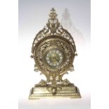 Ornate brass mantel clock with enamel style numbers, 46cm high.