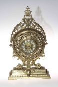 Ornate brass mantel clock with enamel style numbers, 46cm high.