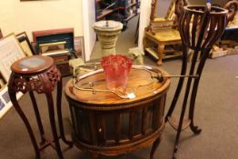 Oval hardwood tray top cocktail cabinet and two plant stands (3).