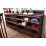 Early 20th Century walnut double bookcase with four adjustable shelves, 305cm by 141cm.
