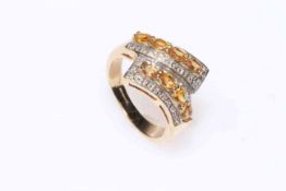 9 carat gold ring set with citrines and diamonds, size P.