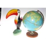 Terrestial globe and a Toucan ornament 41cm.