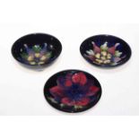 Three small Moorcroft dishes including columbine with warrant label.