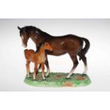 Beswick group of mare and foal on grassy base, 18cm.