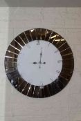 Large contemporary mirror panelled wall clock, 90cm diameter.