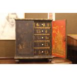 Oriental chinoiserie painted table cabinet having two doors enclosing two short and four long