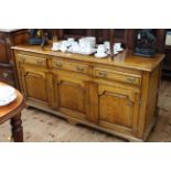 Good quality oak dresser having three drawers above three arched fielded panel doors, 168cm by 84cm.