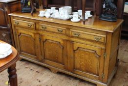 Good quality oak dresser having three drawers above three arched fielded panel doors, 168cm by 84cm.