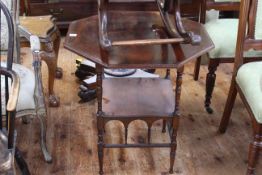 Victorian rosewood octagonal occasional table raised on turned legs with undershelf, 66cm by 69cm.