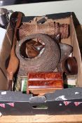 Box of African sculptures, snake skin, miniature chest of drawers, etc.