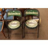 Pair novelty Heineken folding cafe chairs.