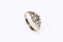 9 carat gold and diamond set flower ring, size R.