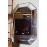 Octagonal silvered marginal wall mirror, 120cm by 80cm overall.