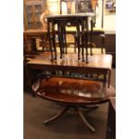 Oval mahogany pedestal coffee table, mahogany sofa coffee table and nest of three tables (3).
