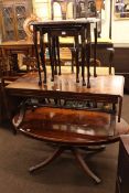 Oval mahogany pedestal coffee table, mahogany sofa coffee table and nest of three tables (3).