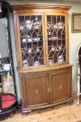 Edwardian inlaid mahogany bow front cabinet bookcase having two astragal glazed doors above two