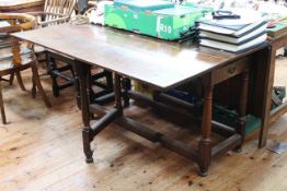 Antique oak two drawer gate leg dining table, 135cm by 77cm (closed).