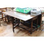 Antique oak two drawer gate leg dining table, 135cm by 77cm (closed).