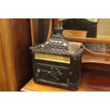 Black and gilt wall mountable letter box.