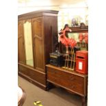 Late Victorian mahogany double door wardrobe with central mirror panel and two base drawers,