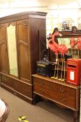 Late Victorian mahogany double door wardrobe with central mirror panel and two base drawers,