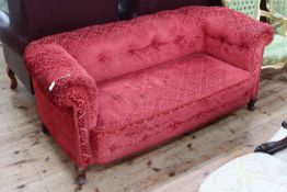 Edwardian settee in red buttoned fabric.